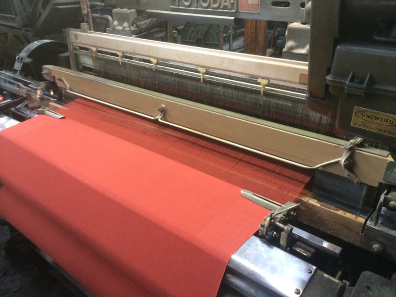 Weaving the fabric of vermillion color!